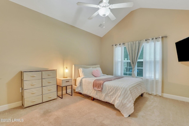 bedroom featuring vaulted ceiling, light colored carpet, and ceiling fan