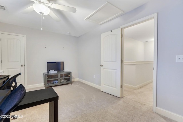 interior space featuring light carpet and ceiling fan