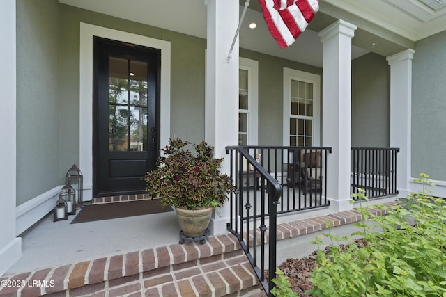 4 Halburton Cir, Bluffton, SC 29910 - property entrance with covered porch and stucco siding