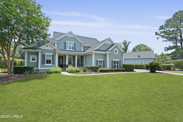 4 Halburton Cir, Bluffton, SC 29910 - craftsman-style house featuring stucco siding, a front lawn, and covered porch