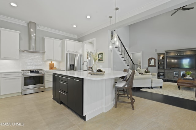 4 Halburton Cir, Bluffton, SC 29910 - kitchen with appliances with stainless steel finishes, wall chimney exhaust hood, open floor plan, light countertops, and white cabinets