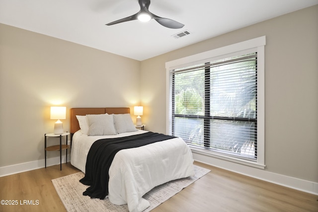 11 Lake Forest Dr Unit 3360, Hilton Head Island, SC 29928 - bedroom with wood finished floors and a ceiling fan