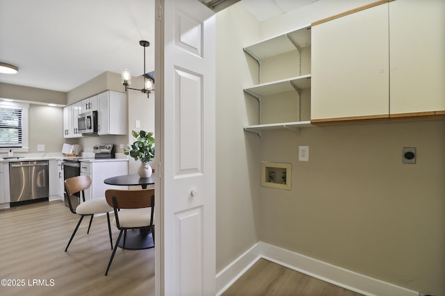 11 Lake Forest Dr Unit 3360, Hilton Head Island, SC 29928 - laundry room featuring electric dryer hookup, light wood-style flooring, and washer hookup
