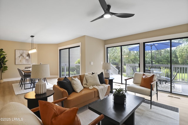 11 Lake Forest Dr Unit 3360, Hilton Head Island, SC 29928 - living room featuring plenty of natural light, light wood-type flooring, and a ceiling fan