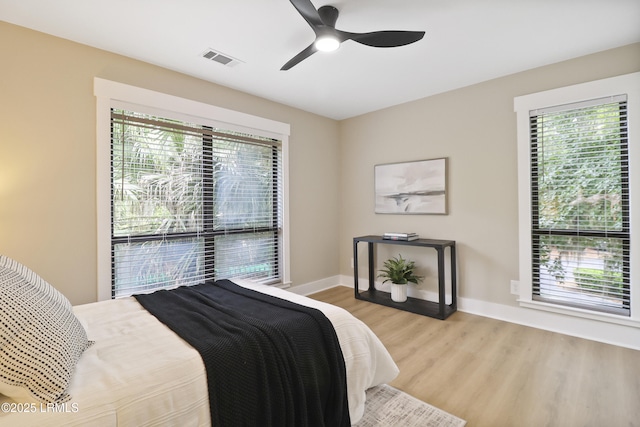 11 Lake Forest Dr Unit 3360, Hilton Head Island, SC 29928 - bedroom with wood finished floors and a ceiling fan
