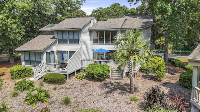 11 Lake Forest Dr Unit 3360, Hilton Head Island, SC 29928 - back of property with a shingled roof and a wooden deck