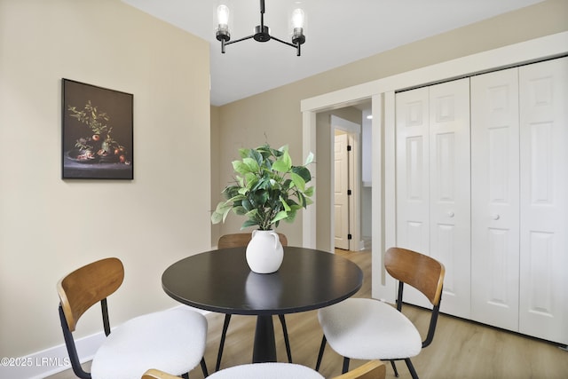 11 Lake Forest Dr Unit 3360, Hilton Head Island, SC 29928 - dining room featuring a chandelier and light wood finished floors