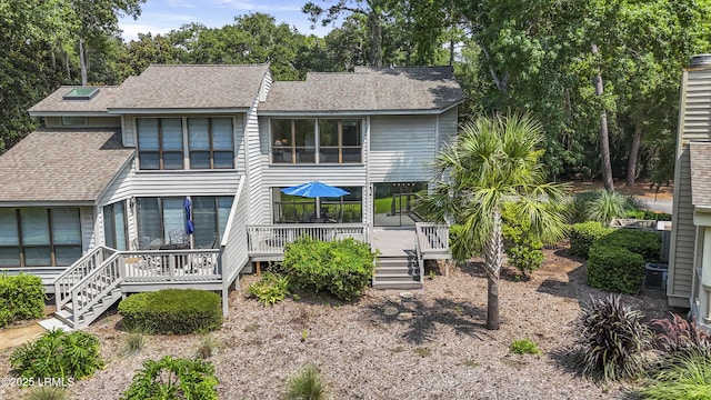 11 Lake Forest Dr Unit 3360, Hilton Head Island, SC 29928 - view of front of house featuring a shingled roof and a wooden deck