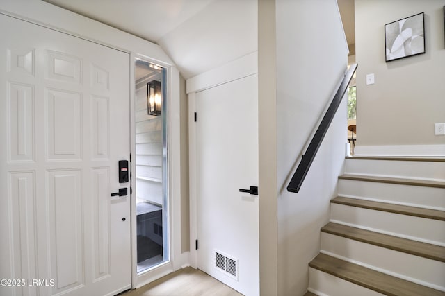 11 Lake Forest Dr Unit 3360, Hilton Head Island, SC 29928 - entrance foyer with vaulted ceiling, stairs, and light wood finished floors