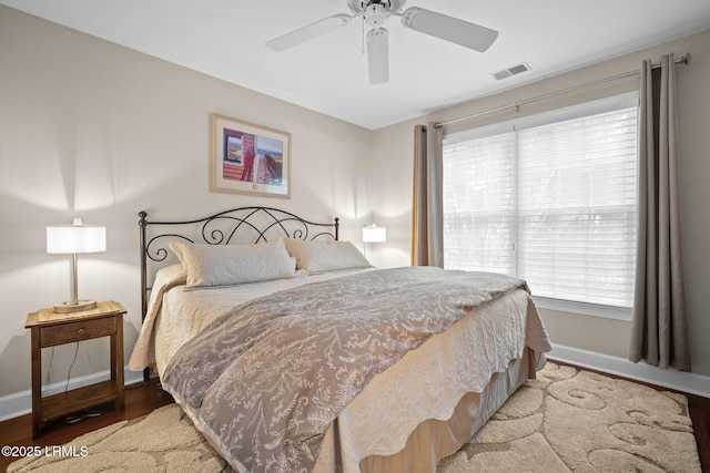1716 Longfield Dr, Saint Helena Island, SC 29920 - bedroom with baseboards, wood finished floors, and ceiling fan