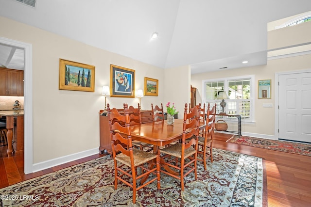 1716 Longfield Dr, Saint Helena Island, SC 29920 - dining room featuring baseboards, wood finished floors, high vaulted ceiling, and recessed lighting