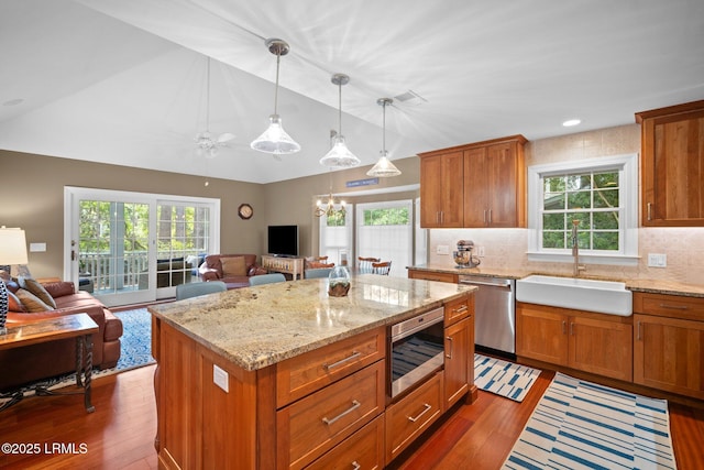 1716 Longfield Dr, Saint Helena Island, SC 29920 - kitchen featuring stainless steel appliances, a sink, open floor plan, dark wood finished floors, and lofted ceiling