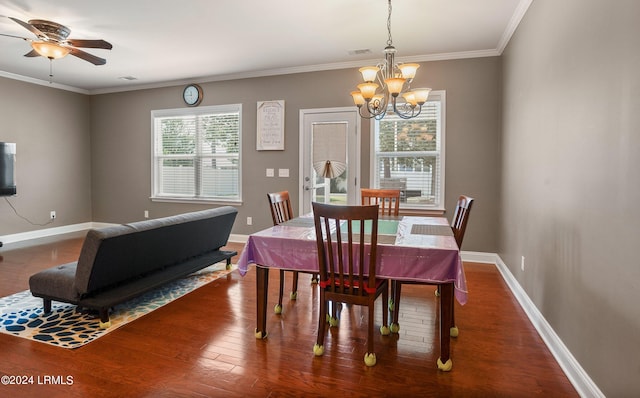 dining room featuring ceiling fan with notable chandelier, dark wood-type flooring, and ornamental molding