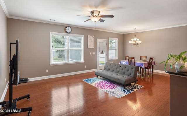 living room with hardwood / wood-style floors, ornamental molding, and a wealth of natural light