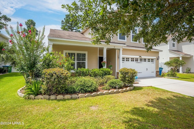 view of front facade with a garage and a front yard