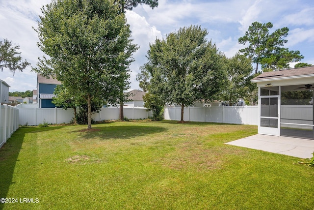 view of yard with a patio area and a sunroom