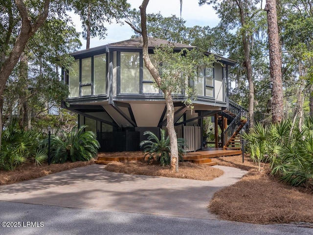 2065 Deer Island Rd, Hilton Head Island, SC 29928 - view of front facade featuring stairway and a carport