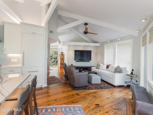 2065 Deer Island Rd, Hilton Head Island, SC 29928 - living room with light wood finished floors, beamed ceiling, ceiling fan, and high vaulted ceiling