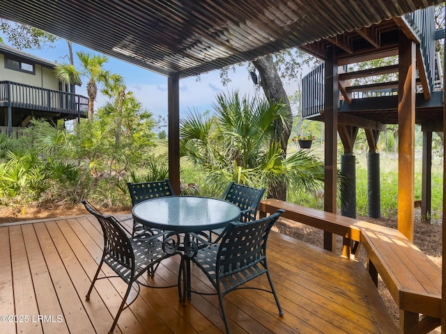 2065 Deer Island Rd, Hilton Head Island, SC 29928 - wooden deck featuring outdoor dining area