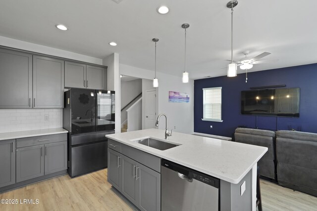 48 Garden Row Dr S, Hardeeville, SC 29927 - kitchen with stainless steel dishwasher, a sink, gray cabinets, light wood finished floors, and recessed lighting