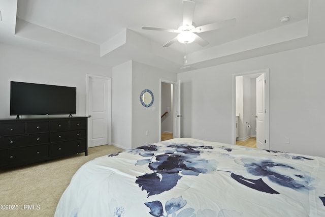 48 Garden Row Dr S, Hardeeville, SC 29927 - bedroom with a tray ceiling, a ceiling fan, light carpet, and connected bathroom