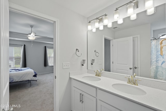 48 Garden Row Dr S, Hardeeville, SC 29927 - ensuite bathroom with double vanity, a ceiling fan, and baseboards