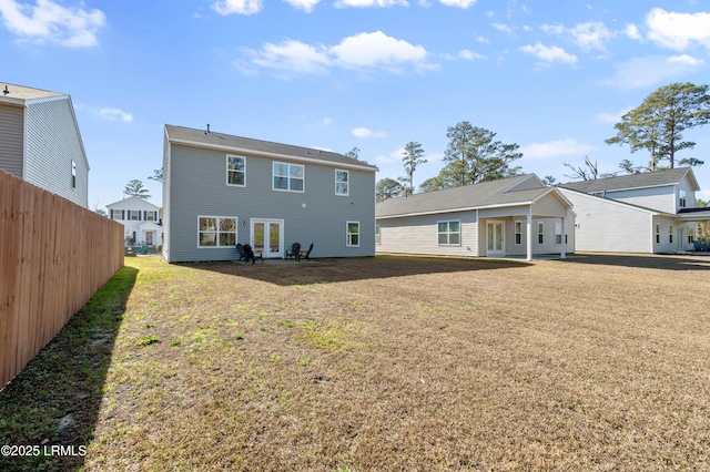 rear view of house with a lawn