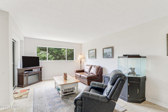 70 Paddle Boat Ln Unit 207, Hilton Head Island, SC 29928 - living area with light tile patterned floors and a textured ceiling