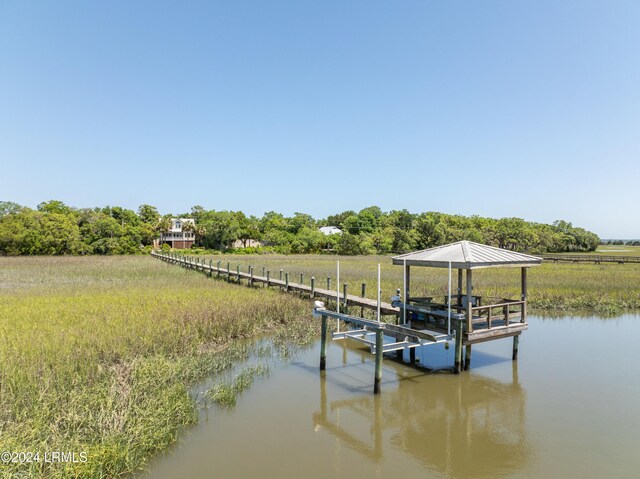 dock area featuring a water view and a rural view