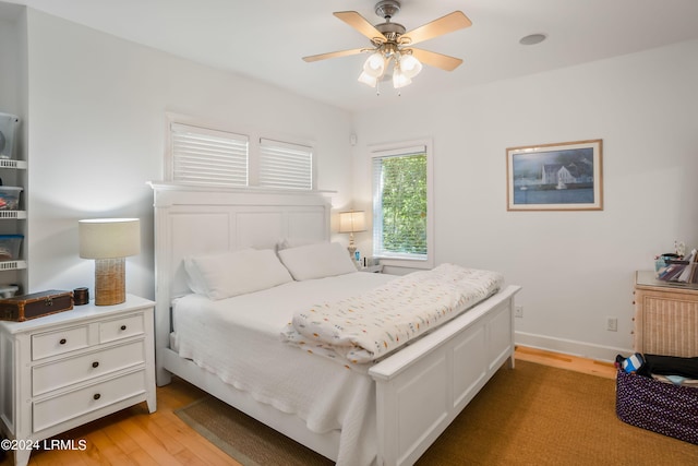 bedroom featuring light hardwood / wood-style flooring and ceiling fan