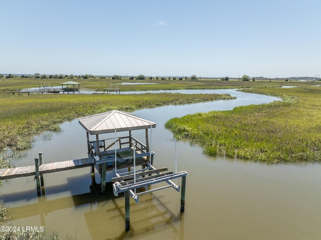 dock area featuring a water view and a rural view