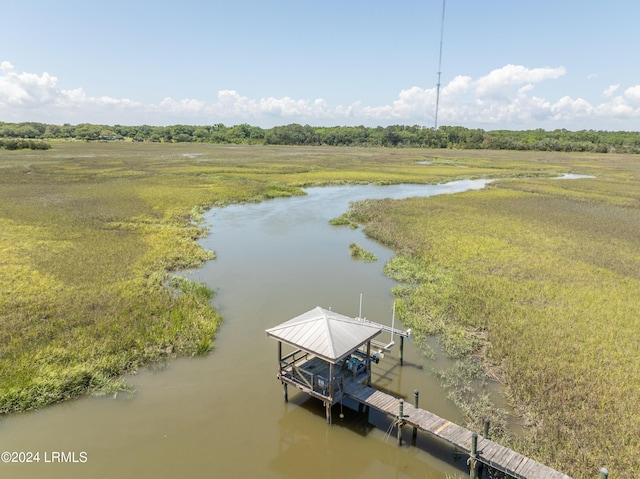 bird's eye view with a water view and a rural view