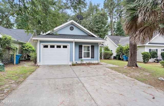 view of front facade featuring a garage and a front lawn