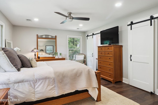 30 Longwood Dr, Okatie, SC 29909 - bedroom with a barn door, dark wood finished floors, recessed lighting, and ceiling fan