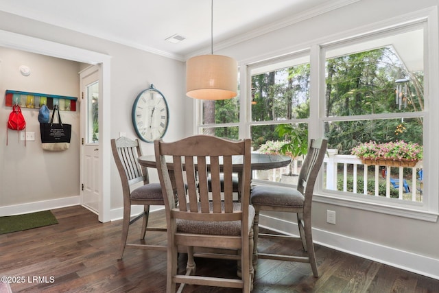 30 Longwood Dr, Okatie, SC 29909 - dining area with baseboards, plenty of natural light, dark wood-style floors, and crown molding