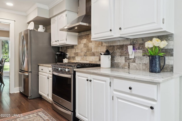 30 Longwood Dr, Okatie, SC 29909 - kitchen with wall chimney range hood, stainless steel appliances, ornamental molding, dark wood-style flooring, and white cabinets