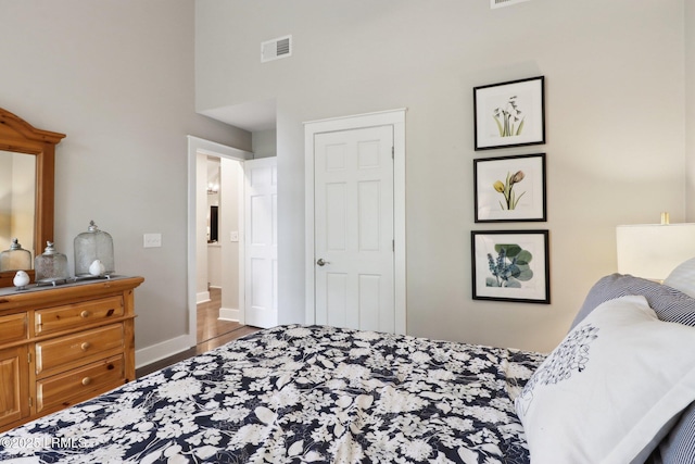 30 Longwood Dr, Okatie, SC 29909 - bedroom with wood finished floors, baseboards, and a high ceiling