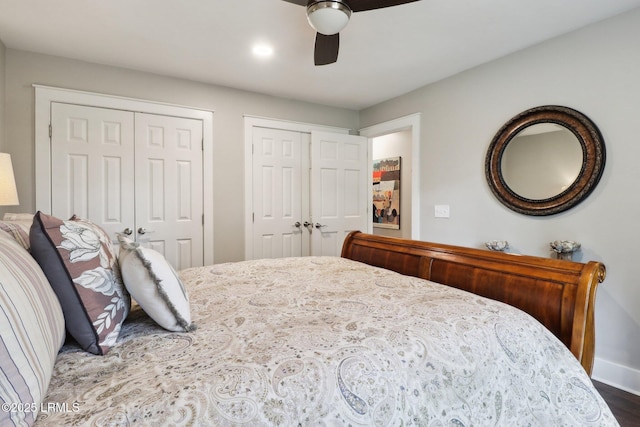 30 Longwood Dr, Okatie, SC 29909 - bedroom with two closets, ceiling fan, wood finished floors, and baseboards