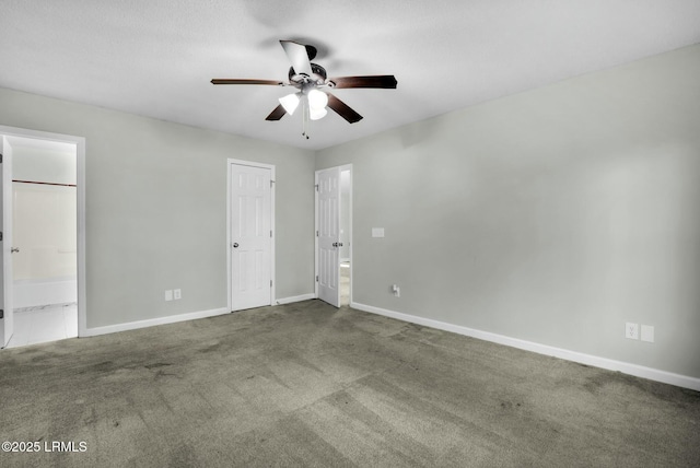 unfurnished bedroom with a ceiling fan, carpet, connected bathroom, and baseboards