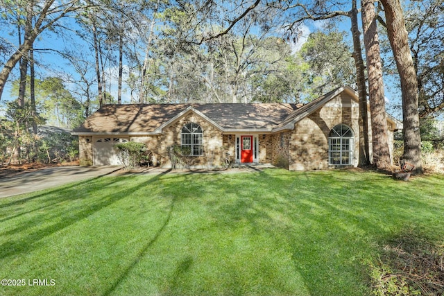 view of front facade featuring a front lawn, concrete driveway, brick siding, and an attached garage