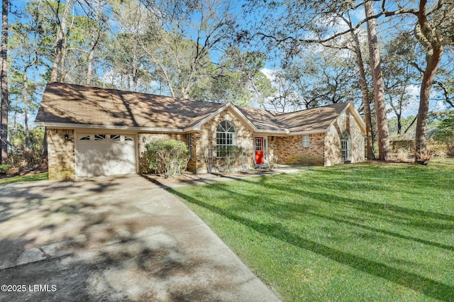 view of front of home with an attached garage, a front lawn, concrete driveway, and brick siding