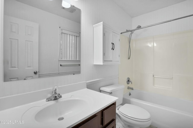 bathroom with visible vents, shower / bathing tub combination, vanity, and toilet