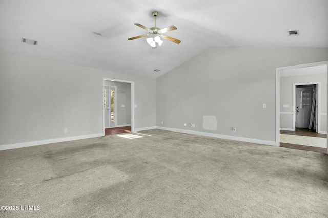 unfurnished room with visible vents, baseboards, vaulted ceiling, a ceiling fan, and carpet