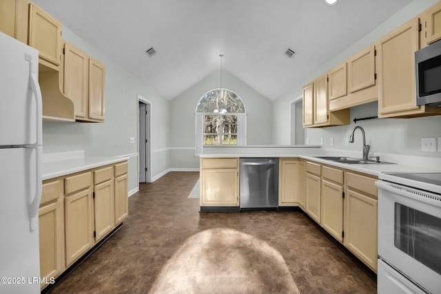 kitchen featuring decorative light fixtures, stainless steel appliances, light countertops, vaulted ceiling, and a sink