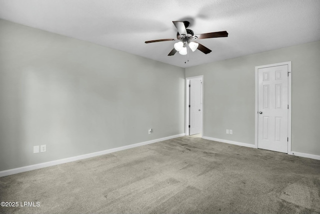 unfurnished room with carpet flooring, ceiling fan, a textured ceiling, and baseboards