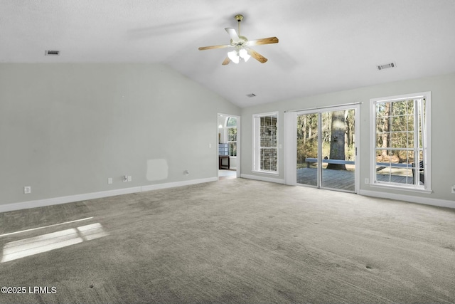 unfurnished living room with lofted ceiling, baseboards, visible vents, and carpet flooring