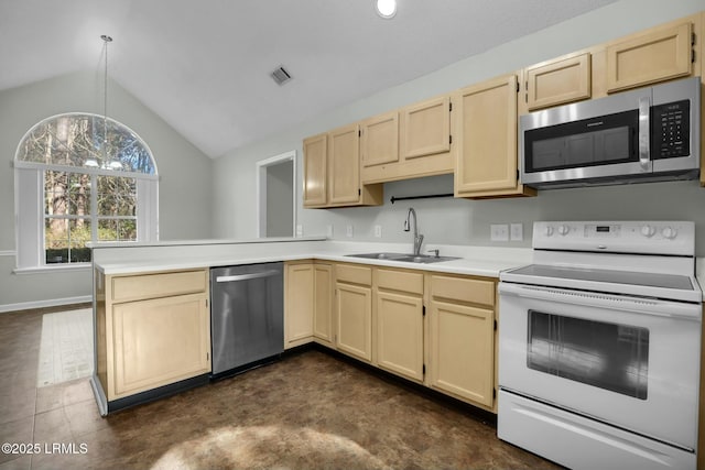 kitchen featuring a peninsula, hanging light fixtures, stainless steel appliances, light countertops, and a sink