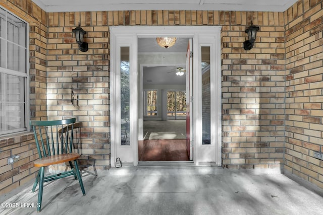 property entrance with brick siding