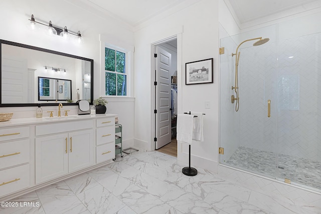 full bathroom with crown molding, a shower stall, and marble finish floor