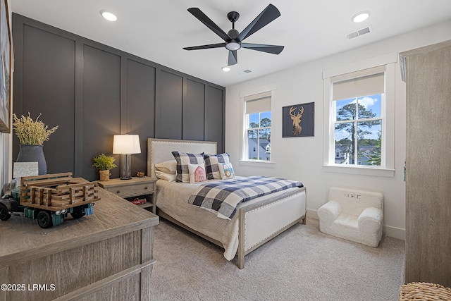 bedroom with visible vents, recessed lighting, baseboards, and light carpet
